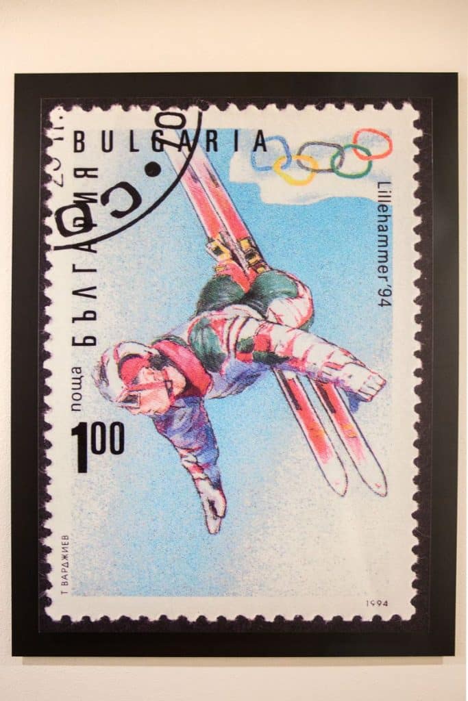 A Bulgarian stamp featuring a ski jumper in mid-air, with the text "Bulgaria 1994" and the Lillehammer Olympic rings.