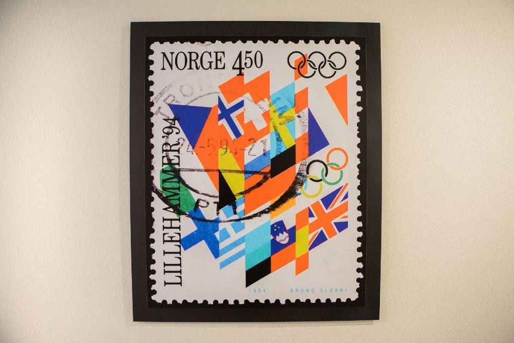 A framed stamp featuring flags, the Olympic rings, "Norge 450," and "Lillehammer '94.