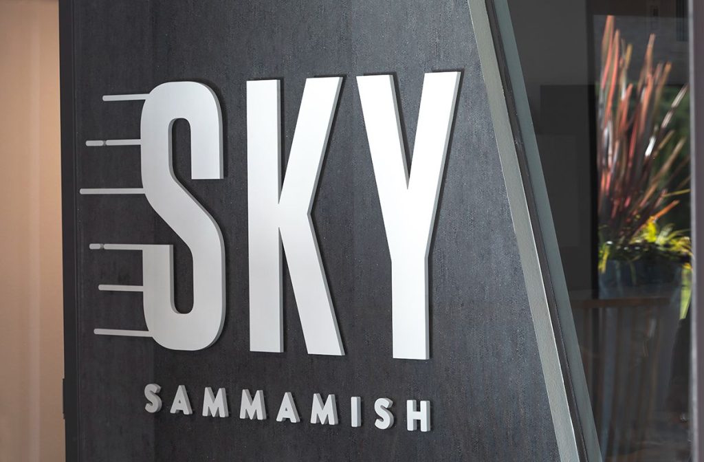 Sign reading "SKY SAMMAMISH" on a textured background.