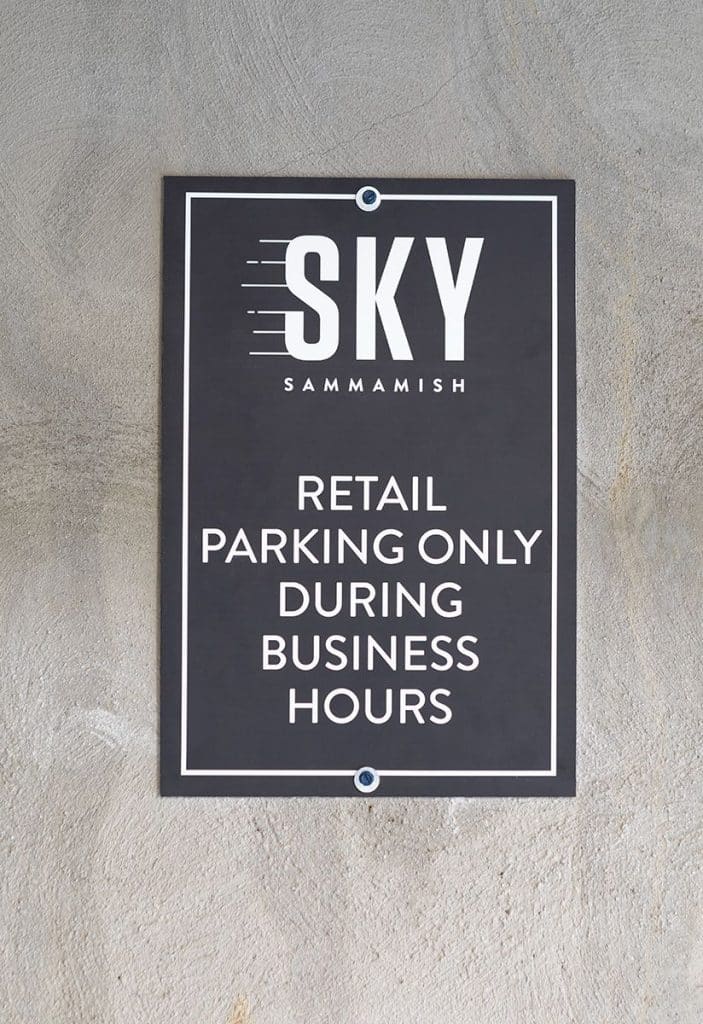 Sign on a wall reads: "SKY SAMMAMISH. Retail parking only during business hours.