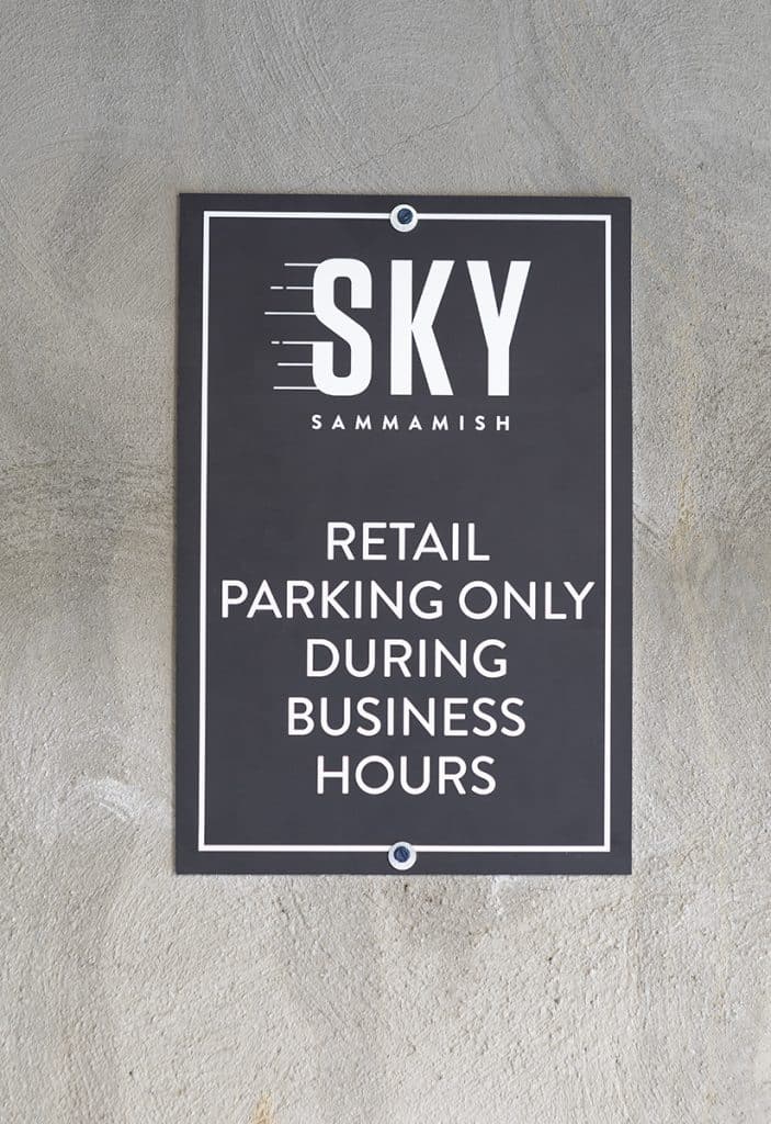 Sign on a wall reads: "SKY SAMMAMISH; Retail parking only during business hours.