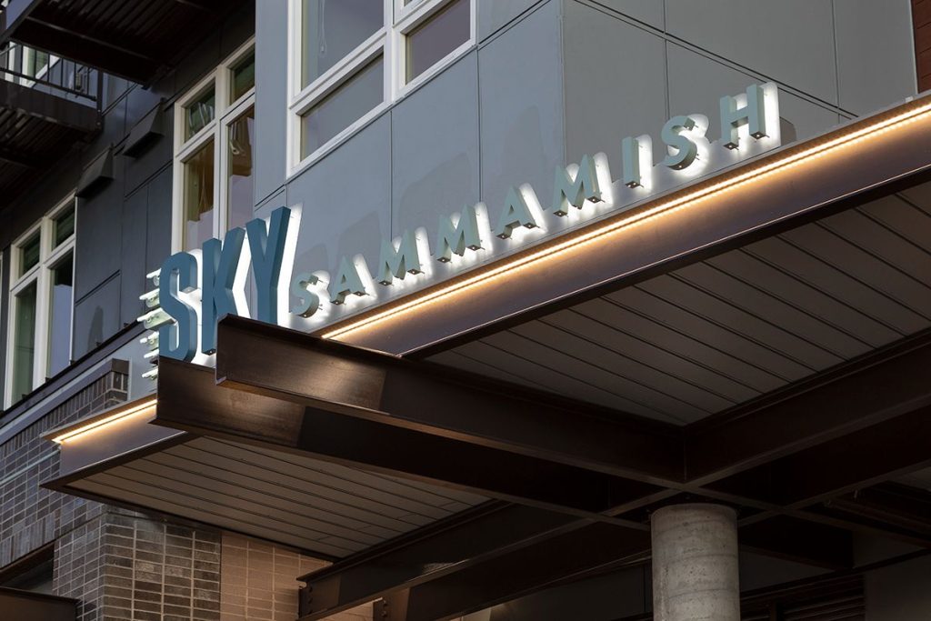 Exterior of a building with a modern canopy displaying the sign "Sky Sammamish.