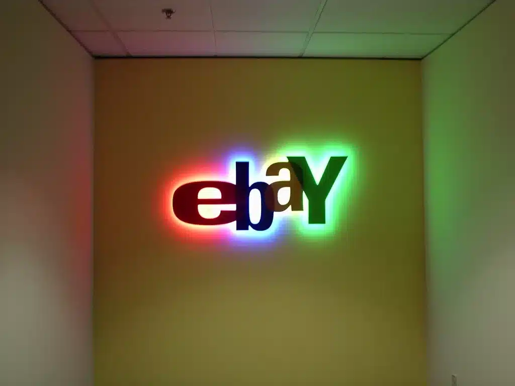 Illuminated eBay logo on a wall, displaying vibrant colors: red, blue, green, and yellow.